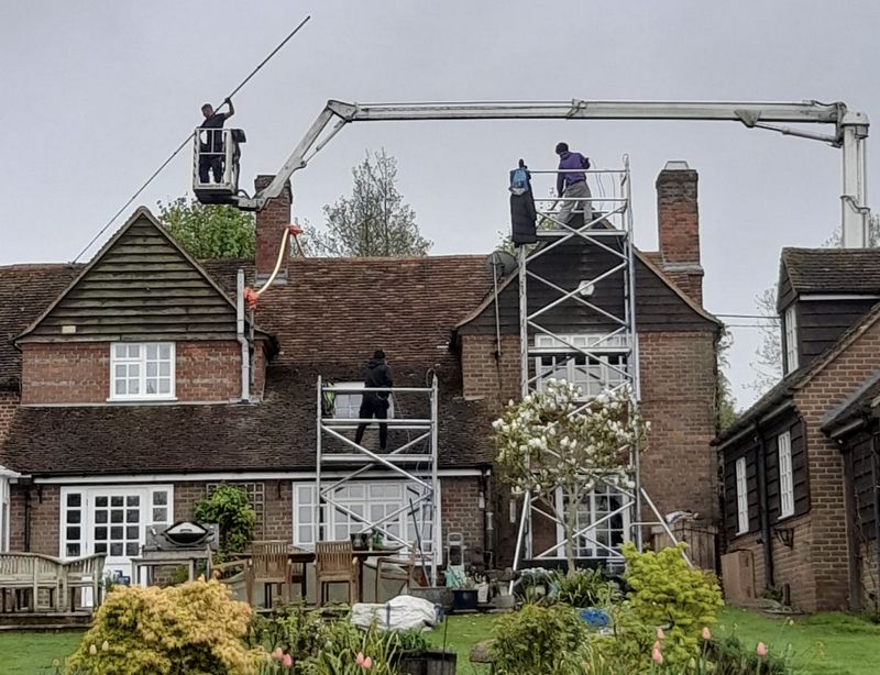 The Moss Cleaners using cherry picker and scaffolding to clean roof safely and professionally in 151 Overhill Rd, London SE22 0PT, UK, 151 Overhill Rd, London SE22 0PT, UK